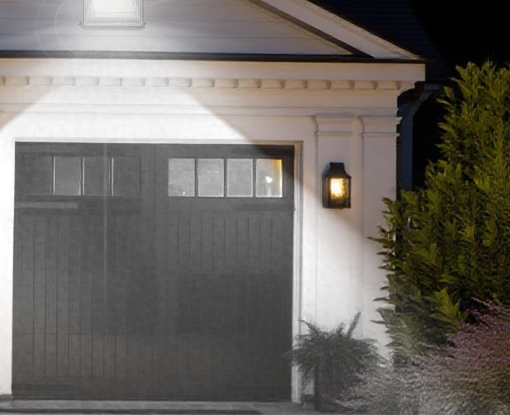 A residential driveway lit at night