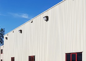 A wall pack on a building in bright sunlight